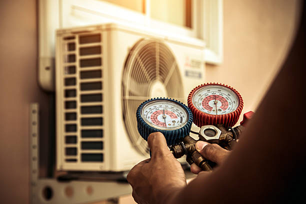Professional Air Conditioning Service technician working in Pescadero, CA
